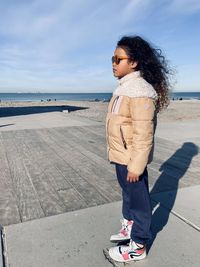 Portrait of girl standing on beach