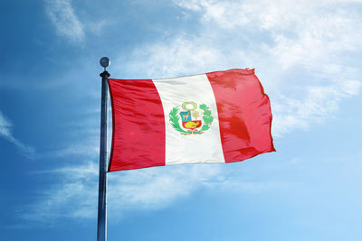 Low angle view of flag against sky