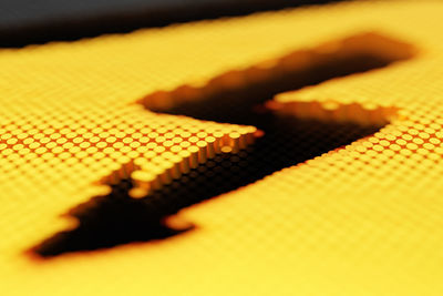 Full frame shot of yellow keyboard on table