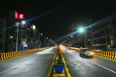 Light trails on road in city at night