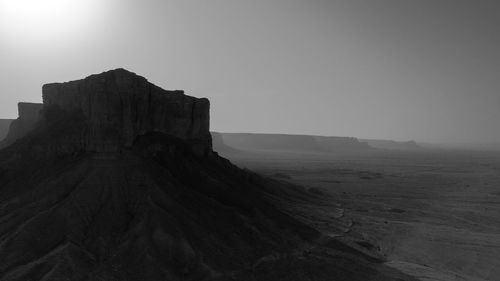 Rock formations on landscape against sky