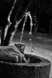 Close-up of hand holding water