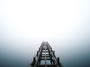 High angle view of pier on lake against sky