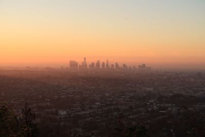 View of cityscape against sky during sunset