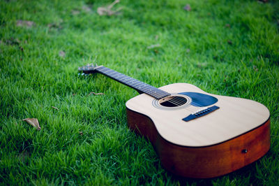 High angle view of guitar on field