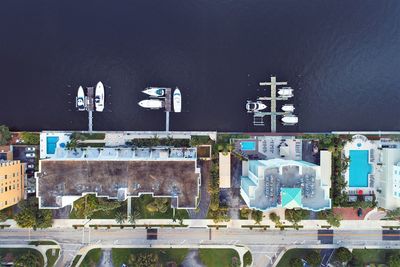 High angle view of information sign by buildings in city