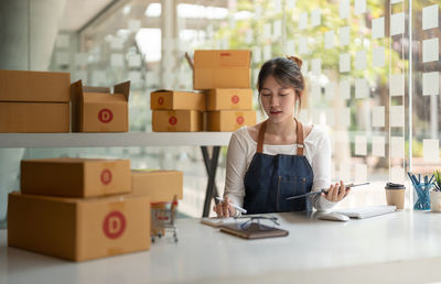 Portrait of smiling entrepreneur working at store