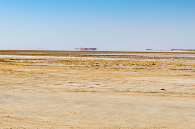 Scenic view of desert against clear sky