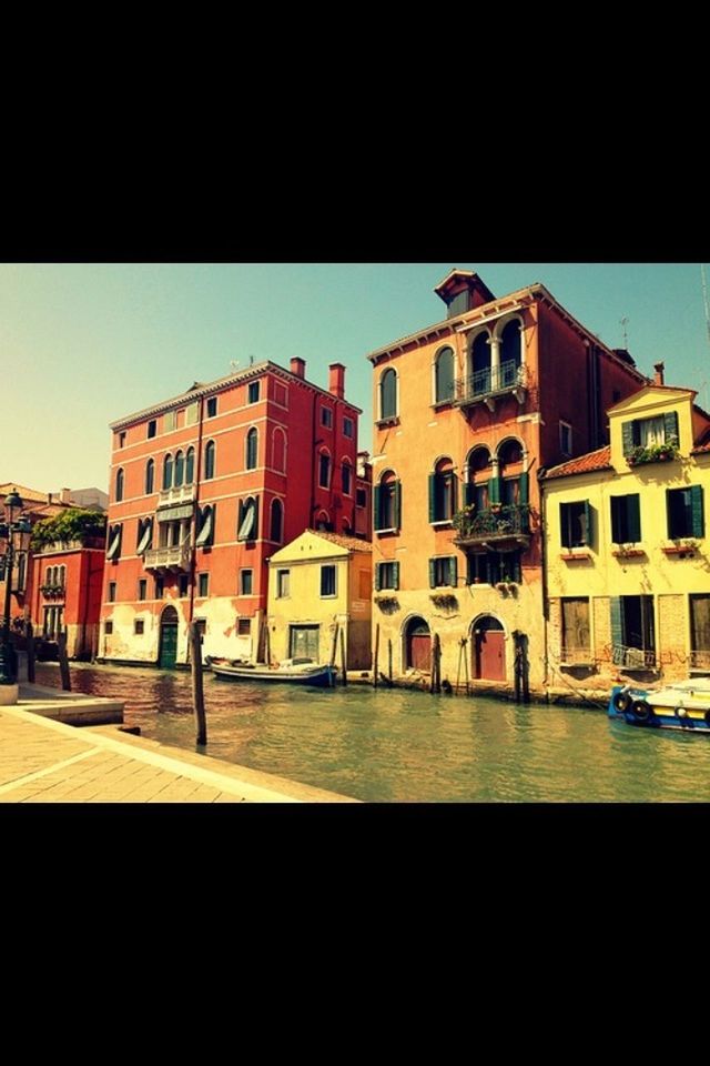 architecture, building exterior, built structure, clear sky, water, nautical vessel, transportation, city, canal, transfer print, residential structure, mode of transport, window, building, residential building, waterfront, auto post production filter, boat, copy space, moored