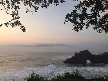 Scenic view of sea against sky at sunset