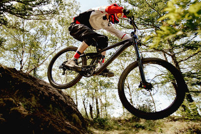 Low angle view of man riding bicycle