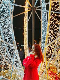 Woman standing at night