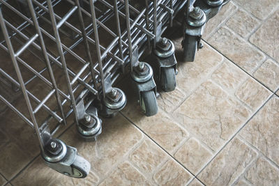 High angle view of shopping cart on tiled floor