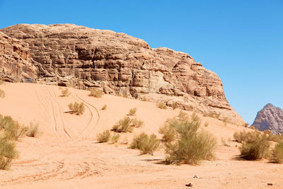 Scenic view of desert against clear sky