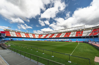 View of soccer field against cloudy sky