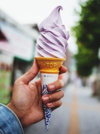 Midsection of person holding ice cream