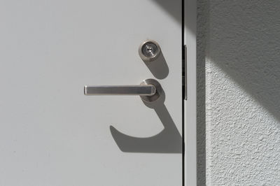 Close-up of door handle on wall
