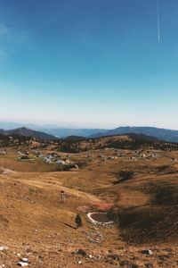 Scenic view of landscape against clear blue sky