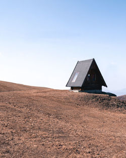 House on field against sky