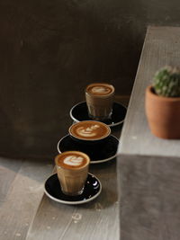 High angle view of coffee served on table