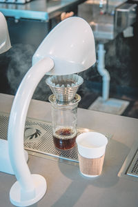 Close-up of coffee cup on table