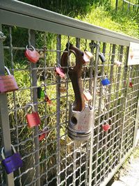 Close-up of padlocks hanging on metal