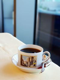 Close-up of coffee cup on table