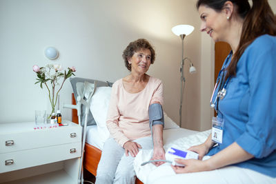 Doctor examining patient in hospital