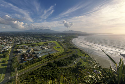 Aerial view of landscape and buildings against sky