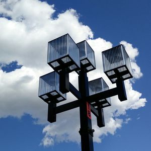 Low angle view of crane against sky