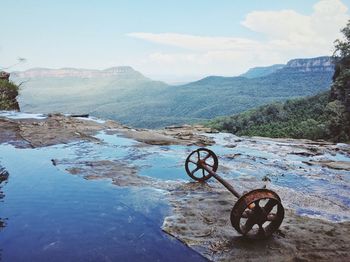 Rusty wheels by mountain range at blue mountains national park