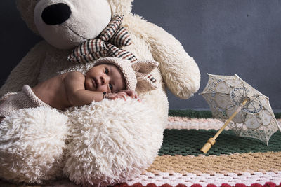 Boy sleeping with stuffed toy at home