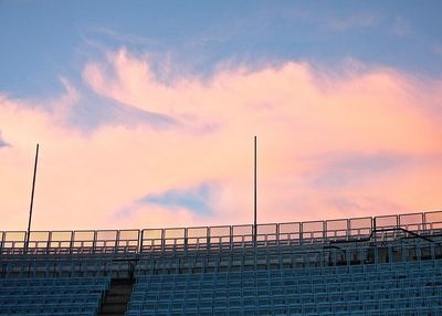 Scenic view of stadium seating against cloudy sky