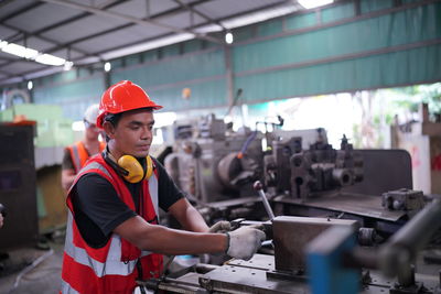 Side view of man working in gym