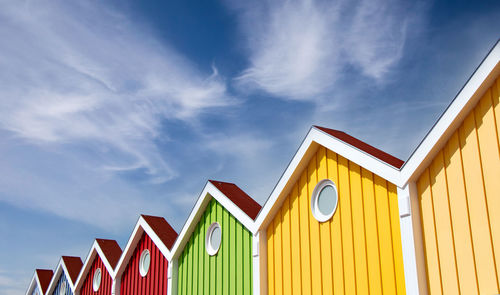 Low angle view of multi colored building against sky