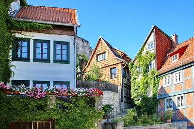 Low angle view of buildings against clear sky