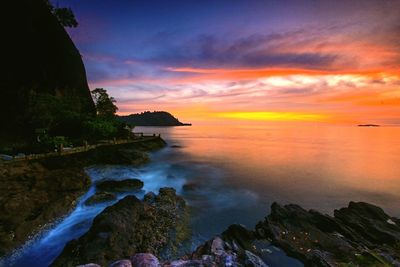 Scenic view of sea against sky at sunset