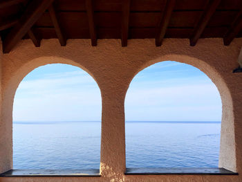 View of sea seen through arch