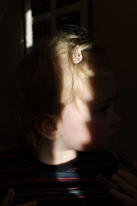 Portrait of boy looking away at home