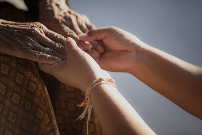 Close-up of hand holding hands