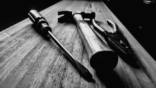Close-up of tools on wooden table