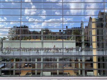 Reflection of buildings on glass window