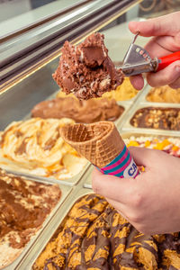 Midsection of person holding ice cream