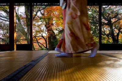 Low section of women walking on floor