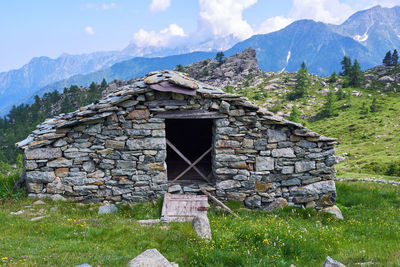 House on field against sky