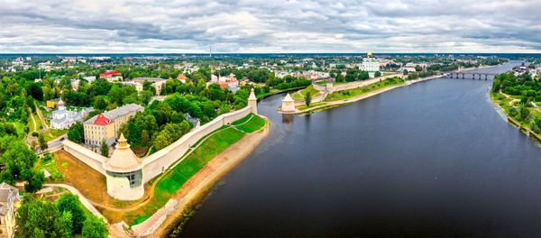 High angle view of buildings against cloudy sky