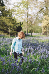 Young woman standing in lavender field