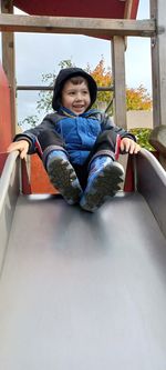 High angle view of cute girl sitting on staircase