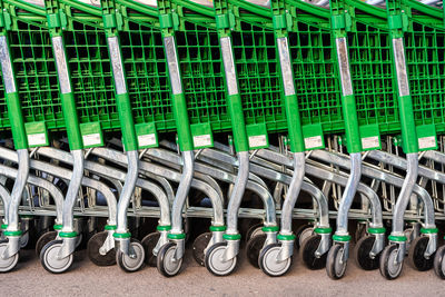 Close-up of shopping cart in row