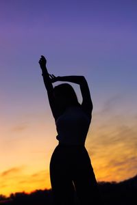 Silhouette man against sky during sunset